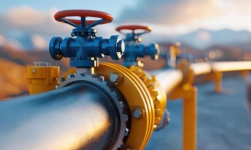 Valve and pipeline infrastructure for industrial fluid control, with a scenic mountain background.